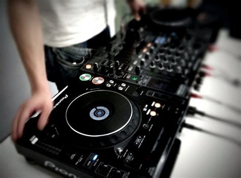 what does dj stand for in music and why are they considered the heart of electronic dance parties?